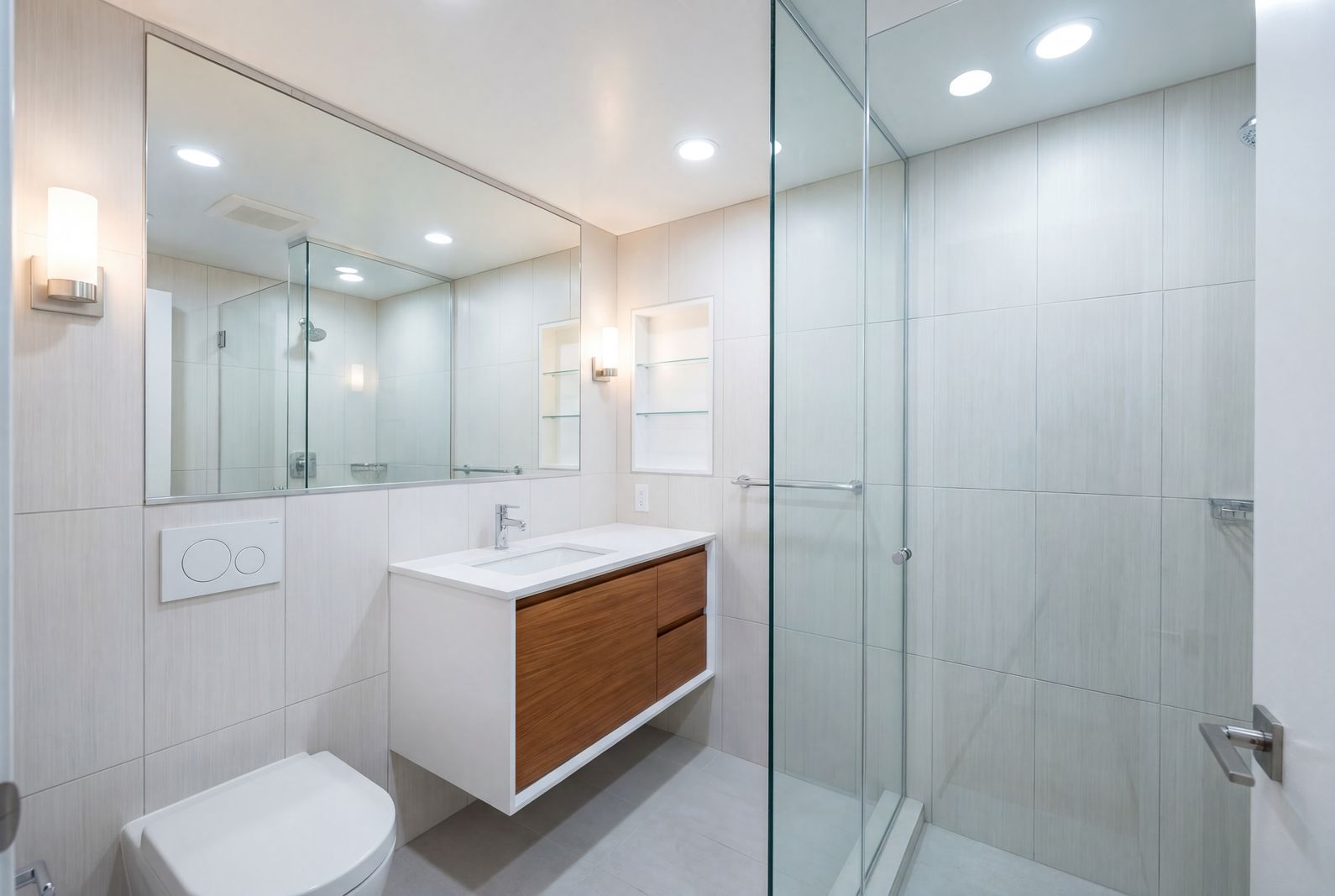 Accessible bathroom with floating vanity and glass shower enclosure